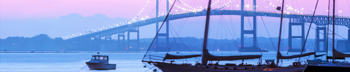 Boats in front of a bridge at twilight in Rhode Island